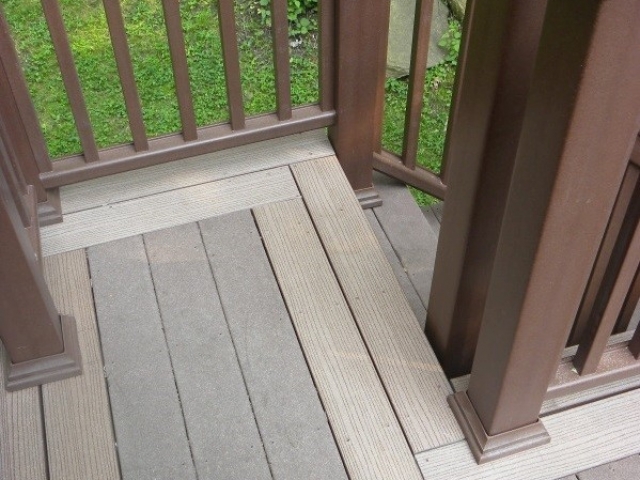 Contrasting deck border installed after tree damage.